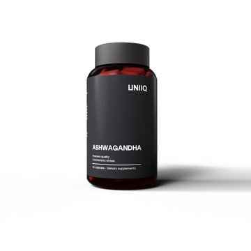 Black supplement bottle labeled 'ASHWAGANDHA' by 'UNIIQ' on transparent background